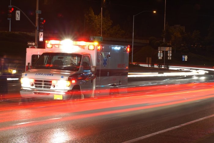 Ambulance driving down the road showing motion | Role of battery-powered aspirators