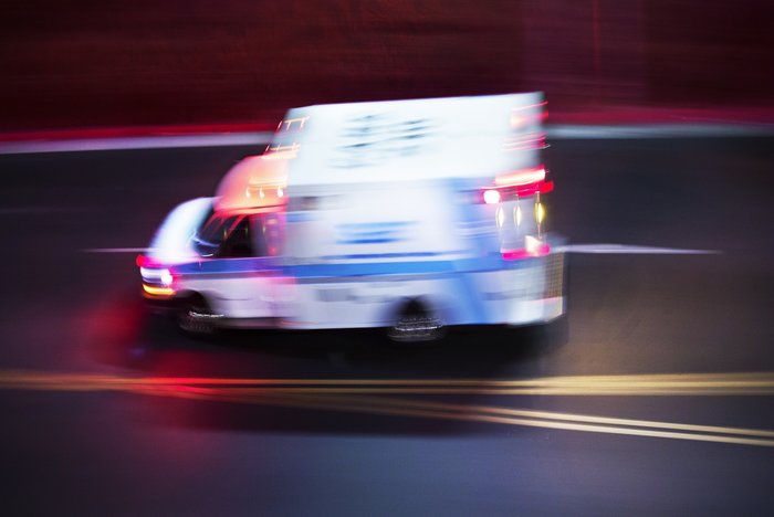 Blurry photo of ambulance speeding to emergency scene