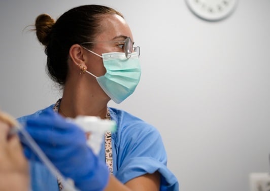 female-healthcare-worker-in-mask-sm