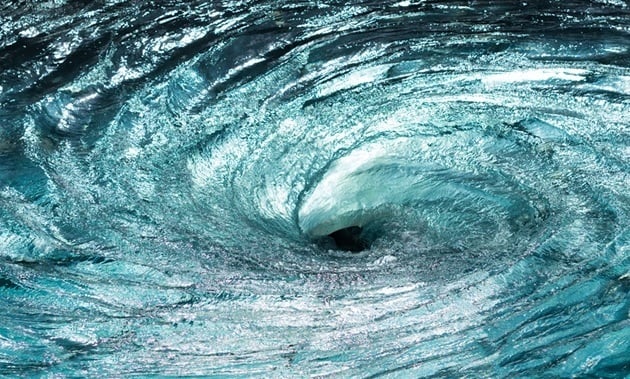 swirling-teal-blue-ocean-water-forming-a-vortex-sm-1